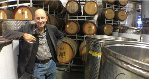 David Farmer among the winery barrels