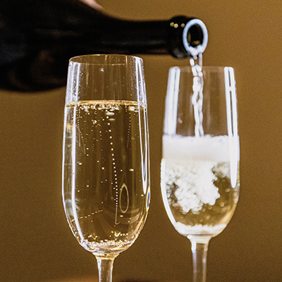 Why champagne bubbles rise in straight lines